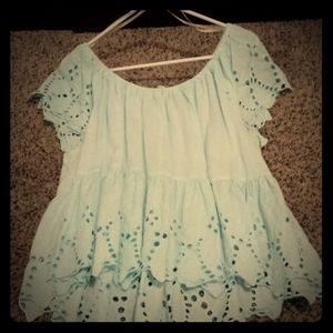 Blue off the shoulder shirt.